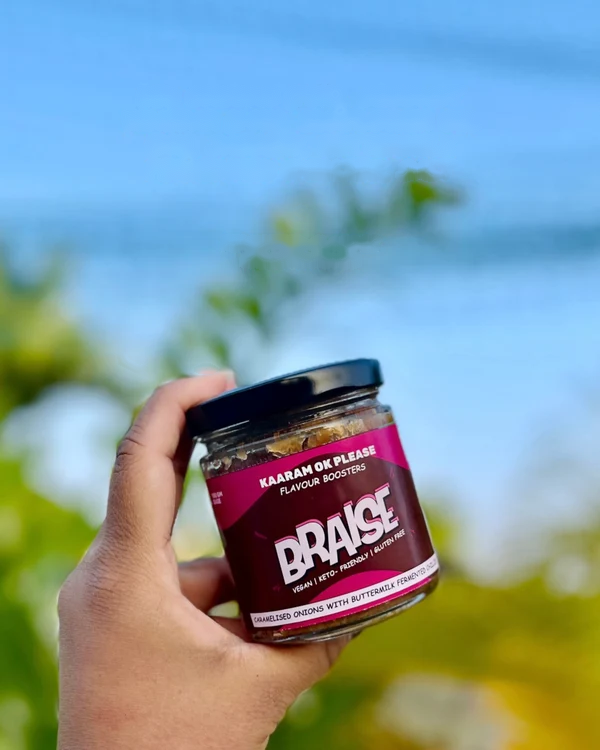 BRAISE - Hand Holding Jar Lifestyle